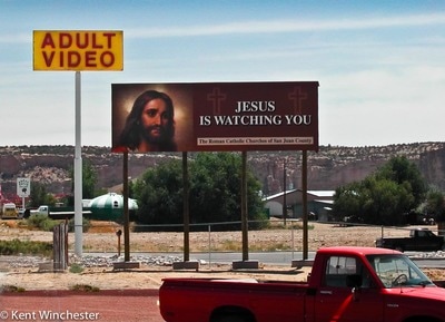 Jesus watching adult video with red pickup.